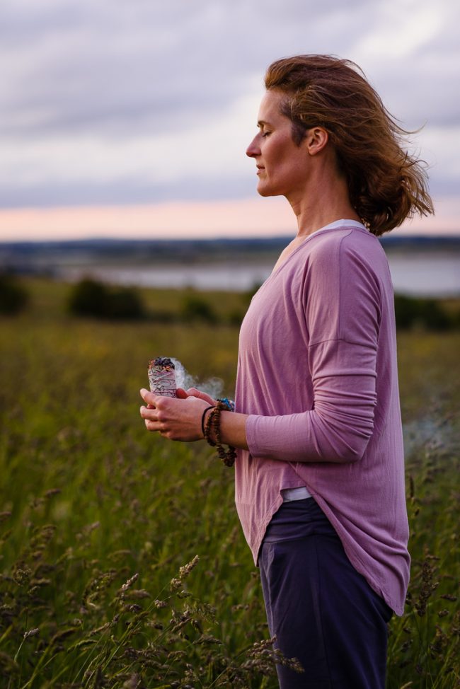 Brand photo of yoga teacher with burning sage