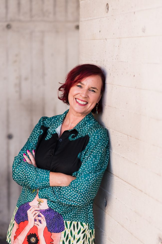 brand shoot leaning against wall