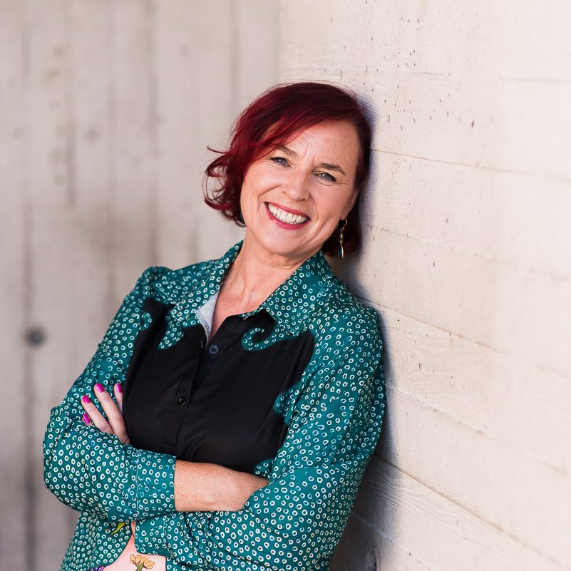 brand shoot leaning against wall