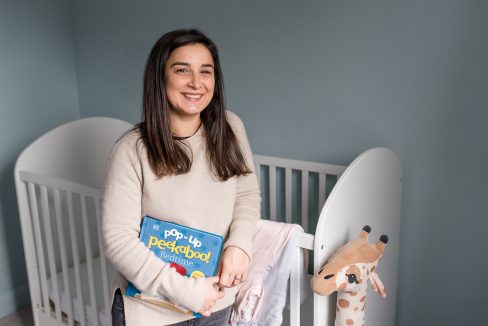 brand by child's cot with book